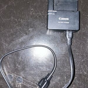 Canon Camera , Battery Charger with Cable, camera bag and batteries , lense
